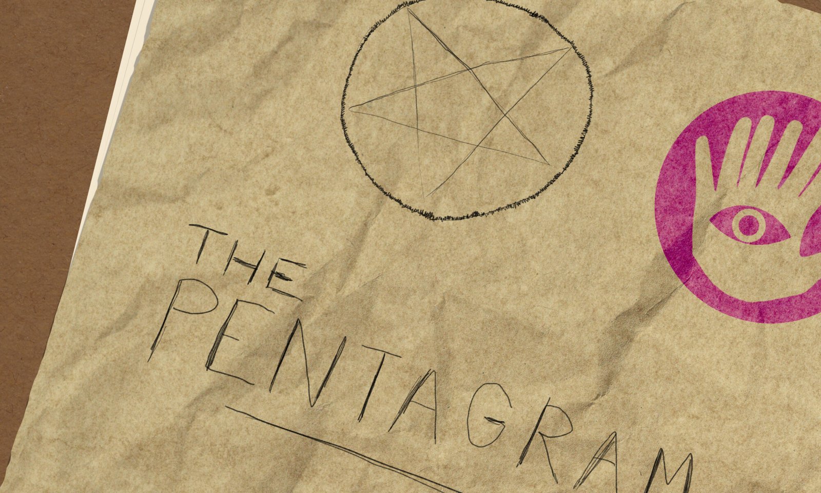 A slightly crinkled paper with a crudely drawn pentagram next to a stamped 7-fingered hand with an eye in the center. Handwritten text: THE PENTAGRAM.